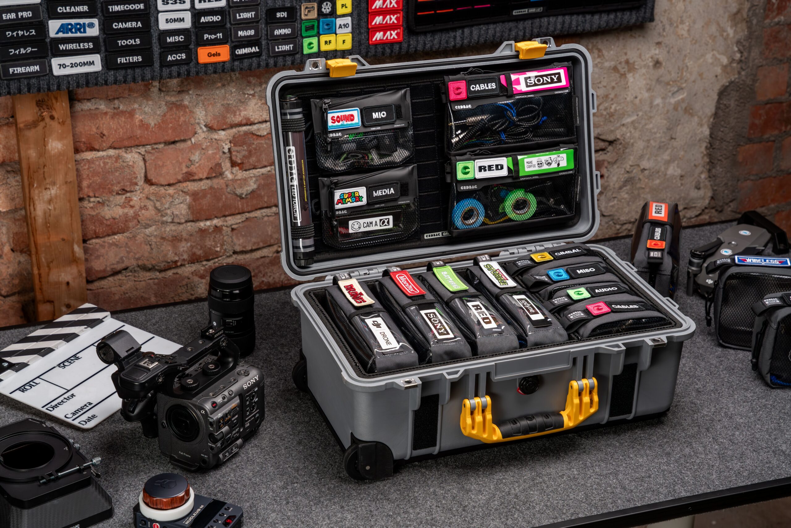 Producten Neatly organized video production gear and camera setup on a table.